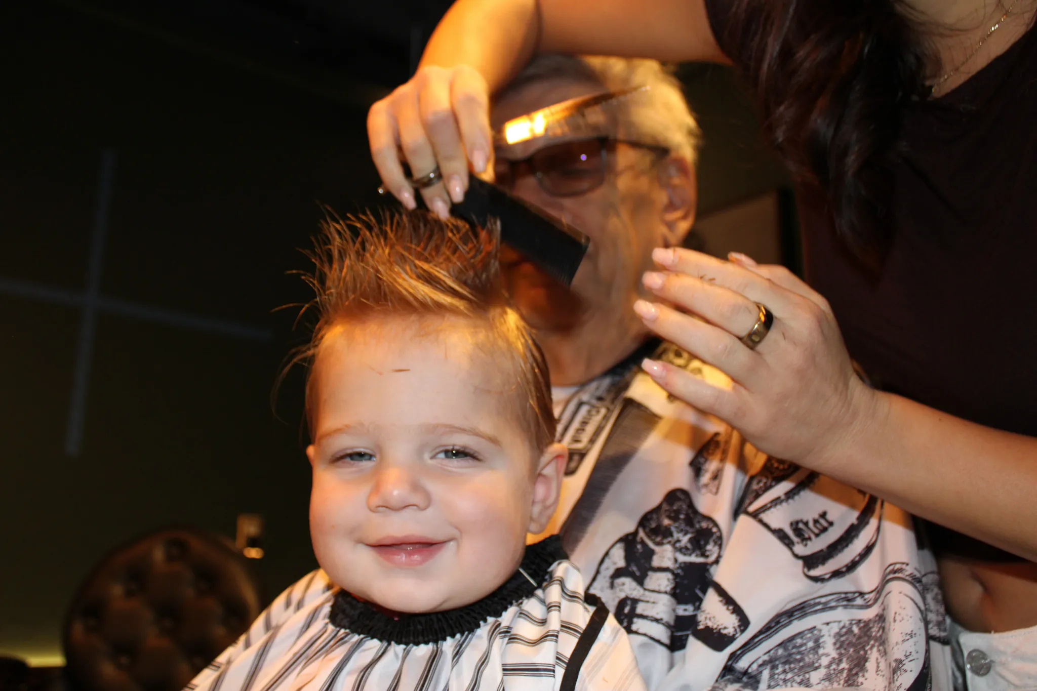 A child's haircut at Vintage Blade Barbershop in Bonita Springs