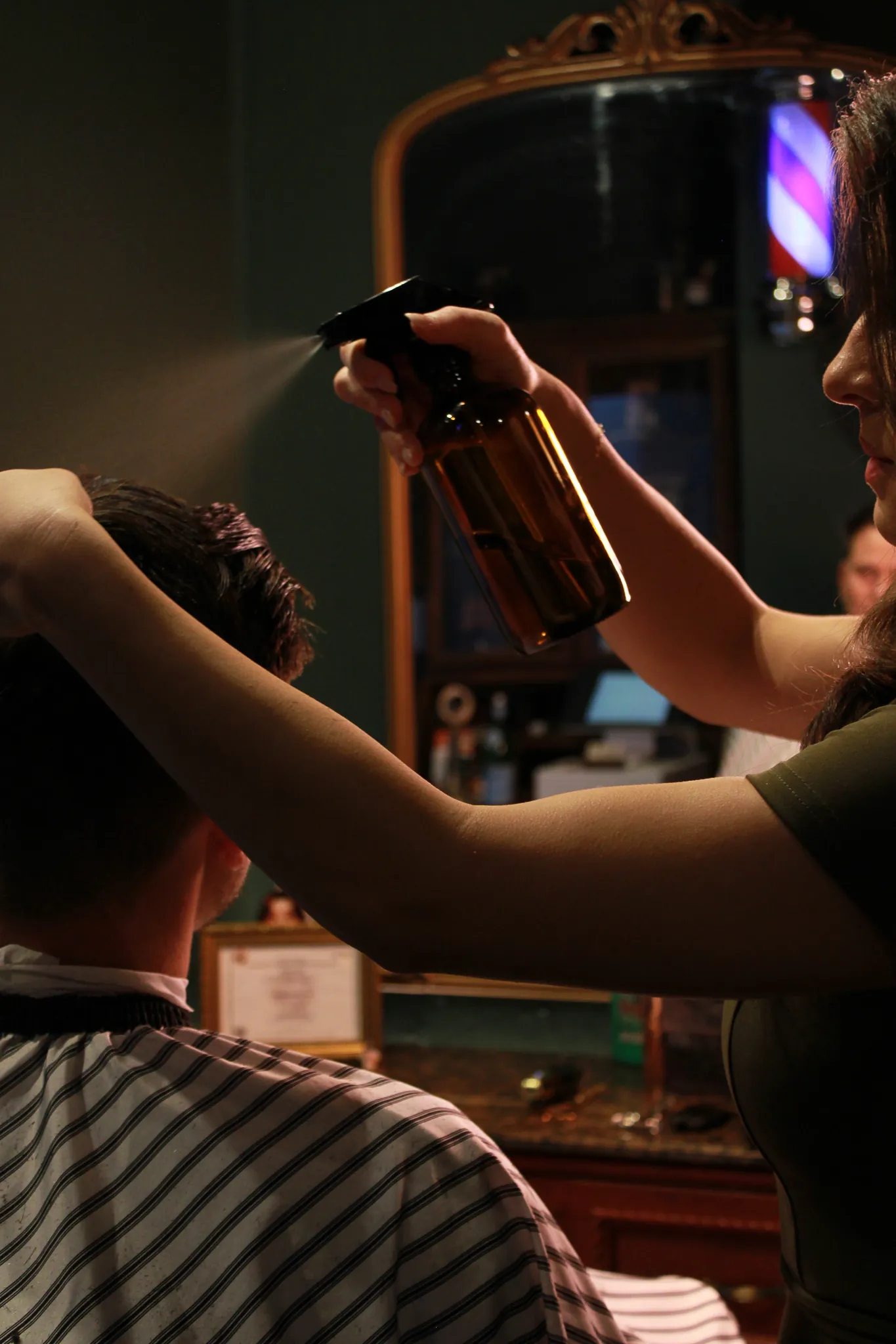 Inside Vintage Blade Barbershop — the chair and green styling room